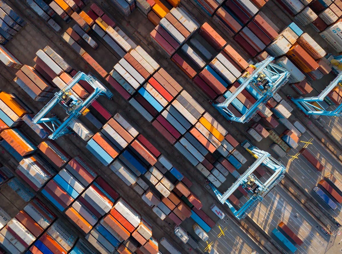 Aerial view of a container yard with straddle carriers at work